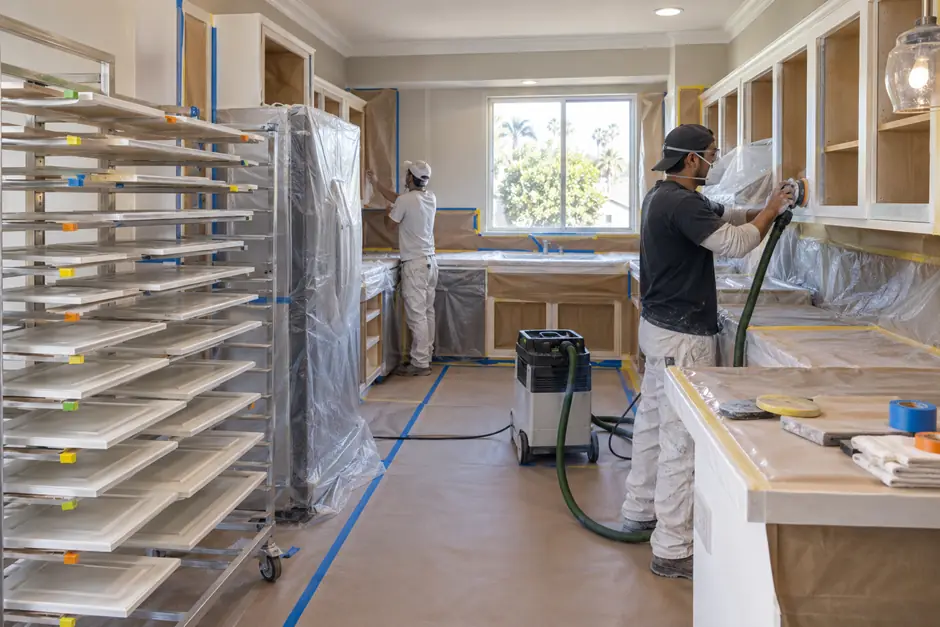 Professional cabinet painting preparation inside a residential kitchen.